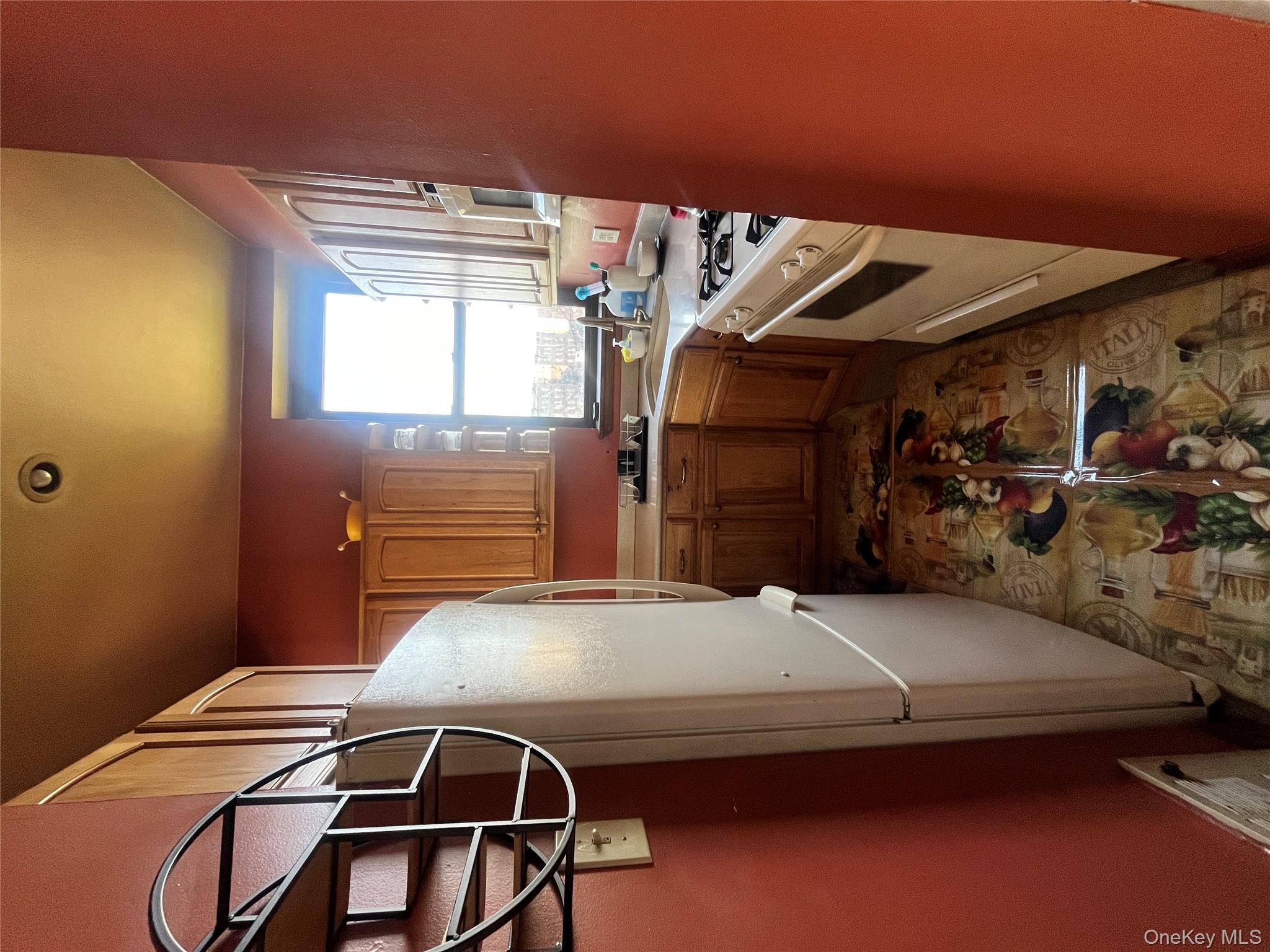 451 West 162nd Street, Unit 3 Manhattan, NY 10032 - Photo 5 of 12 a kitchen with sink a refrigerator and window