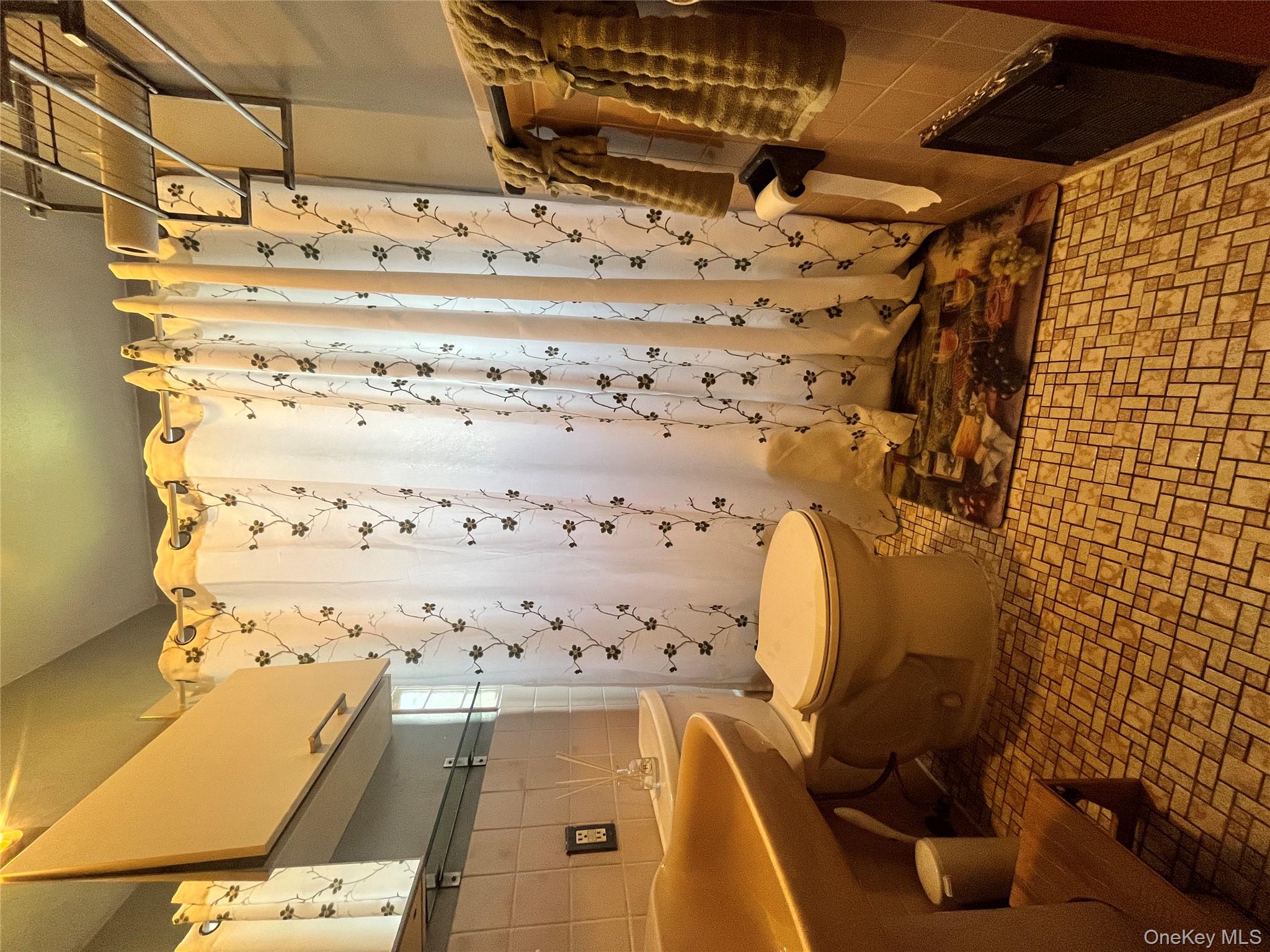 451 West 162nd Street, Unit 3 Manhattan, NY 10032 - Photo 6 of 12 a bathroom with a sink toilet and shower