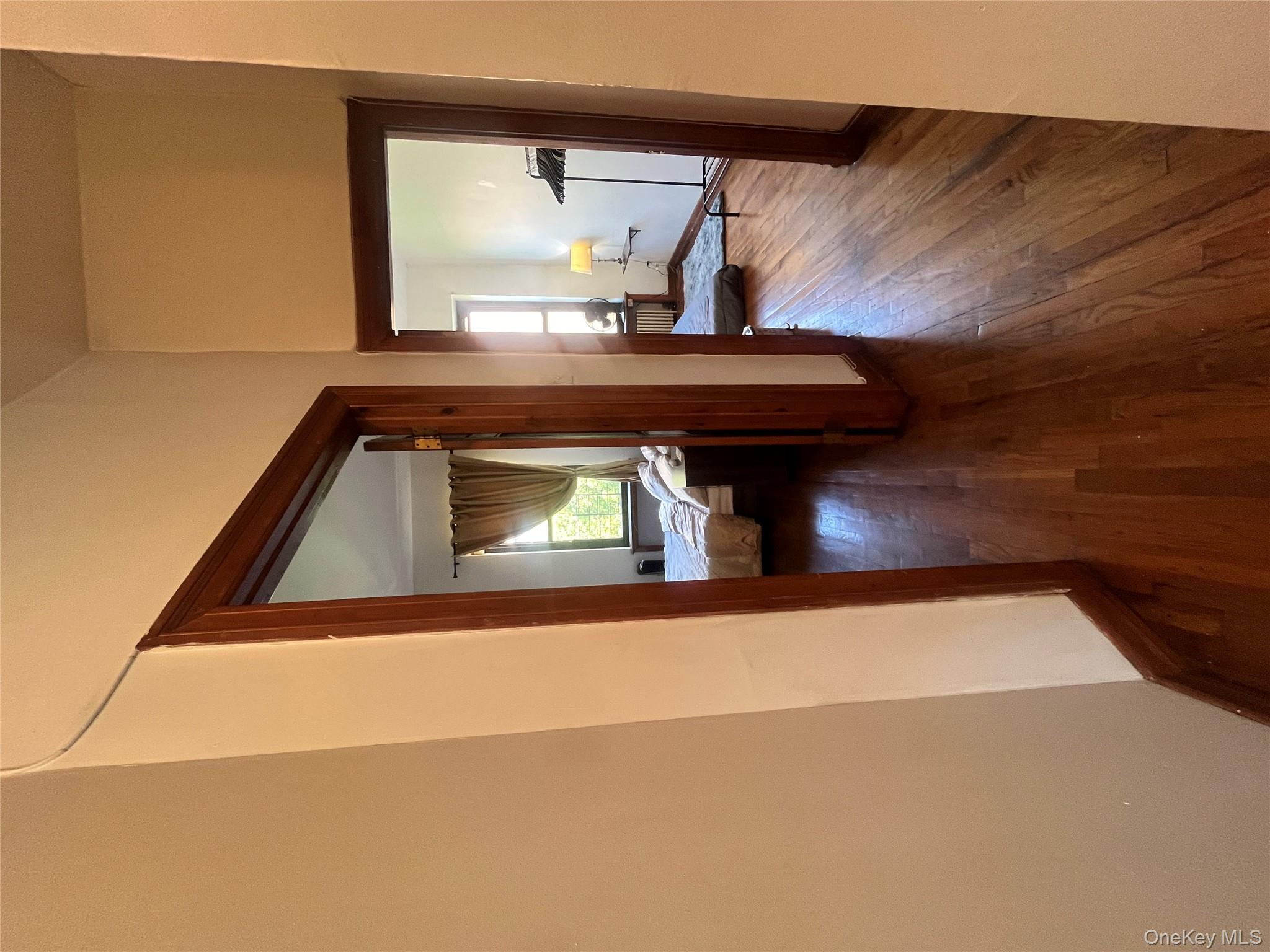 451 West 162nd Street, Unit 3 Manhattan, NY 10032 - Photo 7 of 12 a view of a bedroom from a hallway