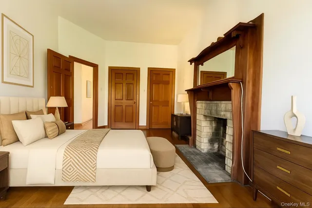 a bedroom with a bed and a fireplace