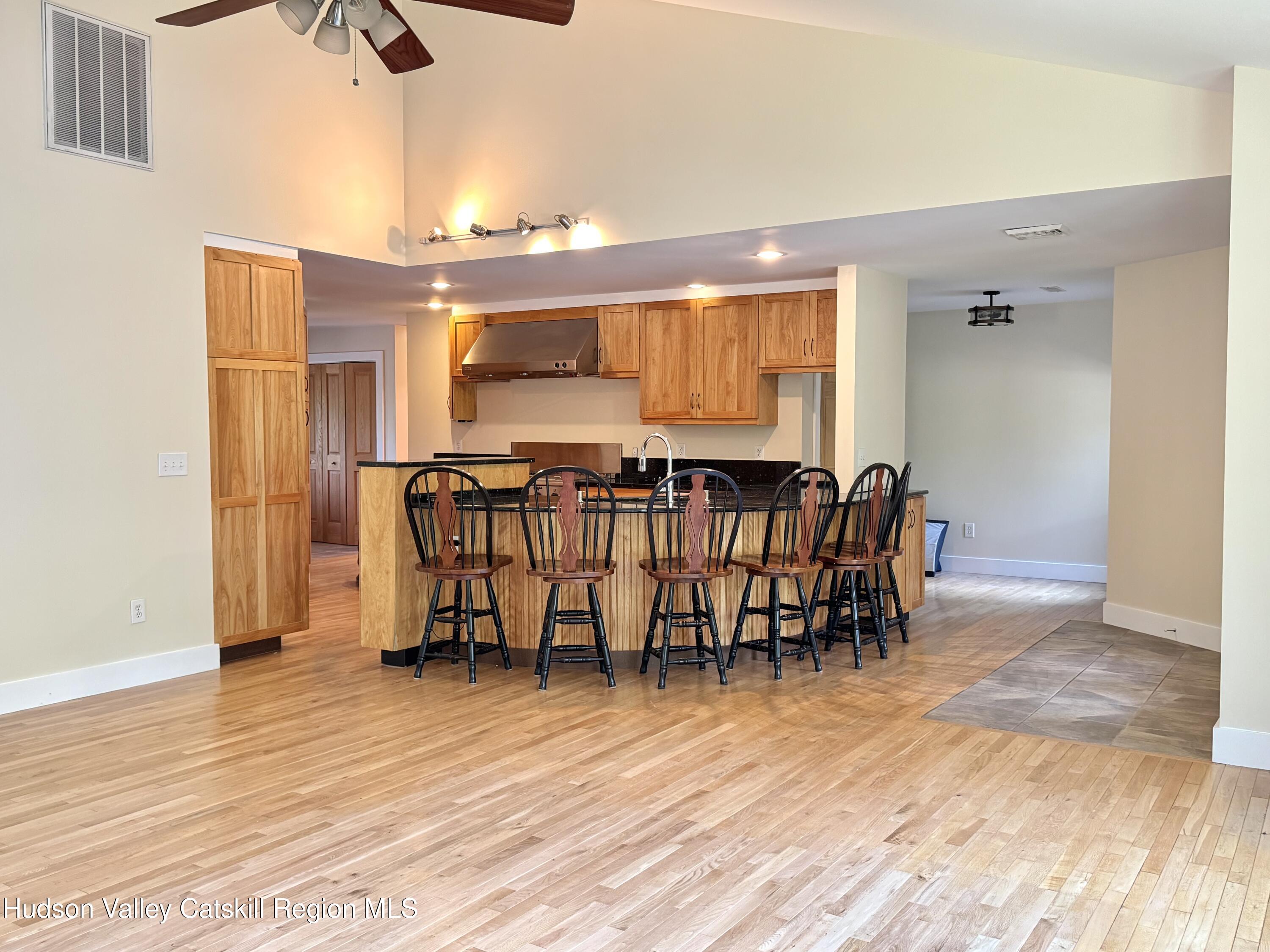 86 Paul Horn Road Catskill, NY 12414 - Photo 9 of 41 a view of a dining room with furniture and wooden floor