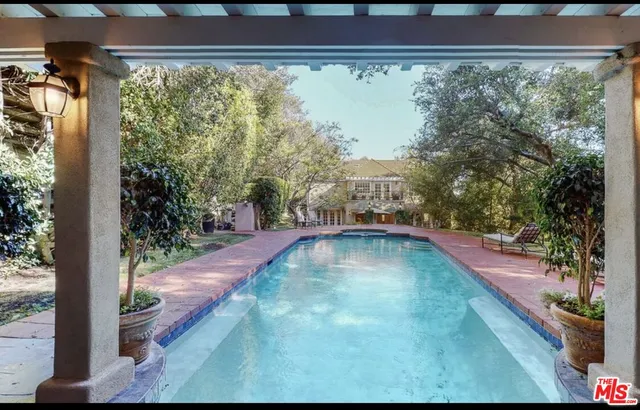 a view of swimming pool from a window