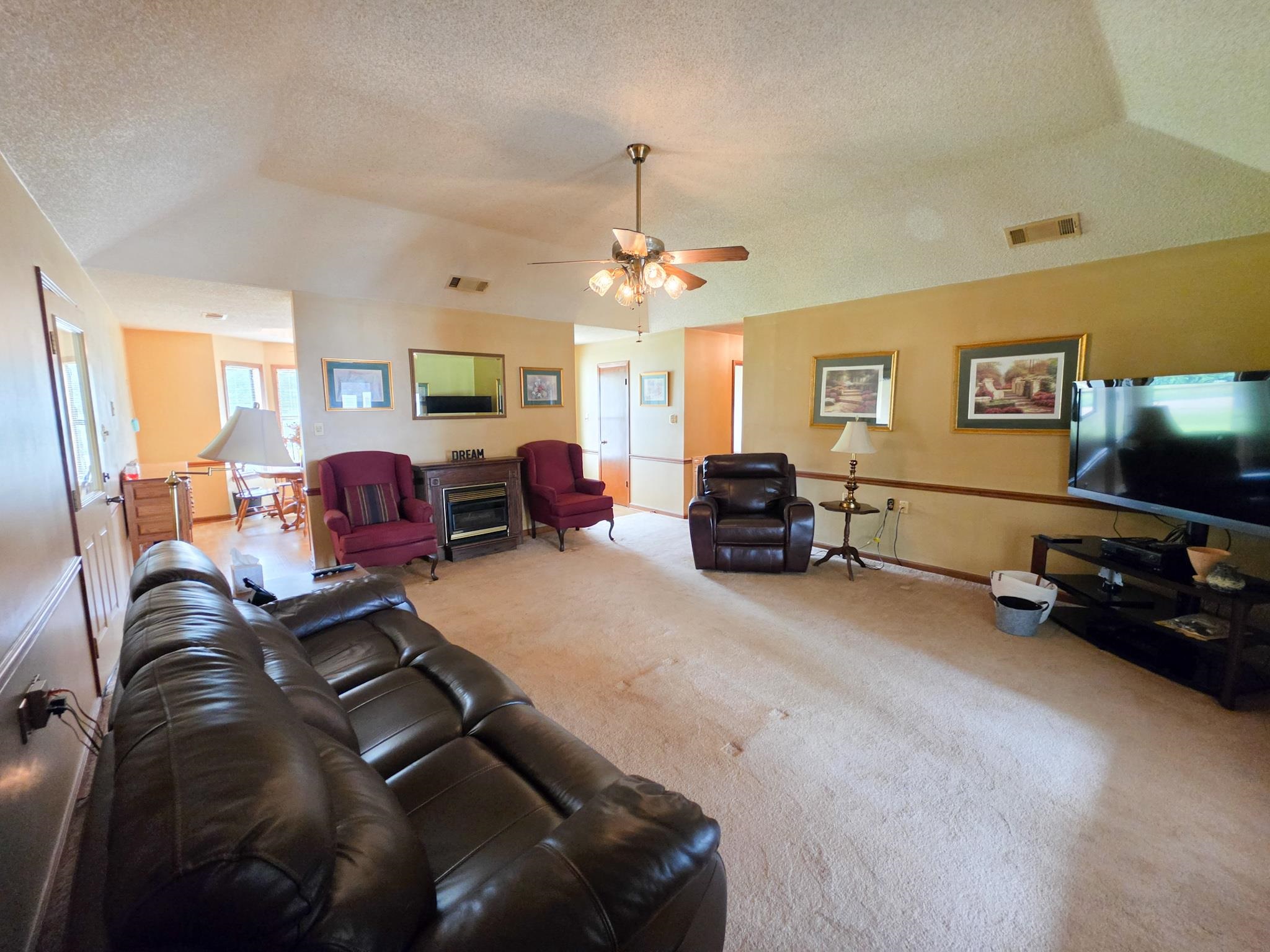 966 Beaver Road Munford, TN 38058 - Photo 24 of 32 Spacious interior featuring vaulted ceilings, a ceiling fan, and carpeted flooring