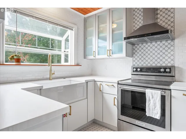 a kitchen with a stove and a sink