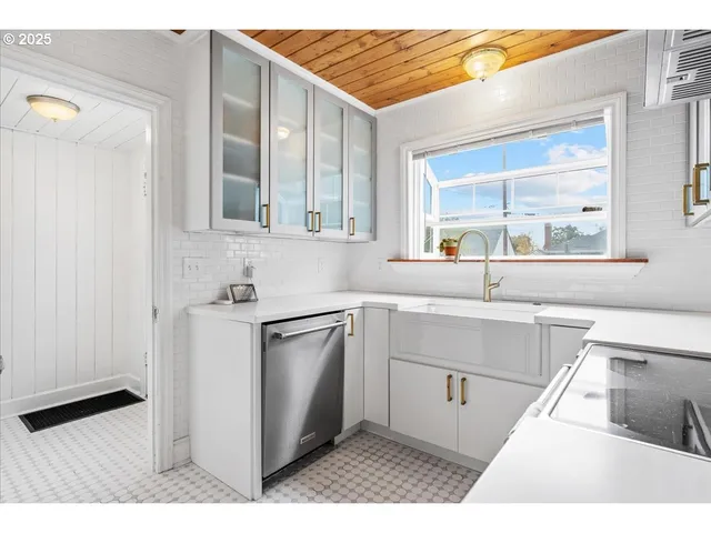 a kitchen with a sink and cabinets