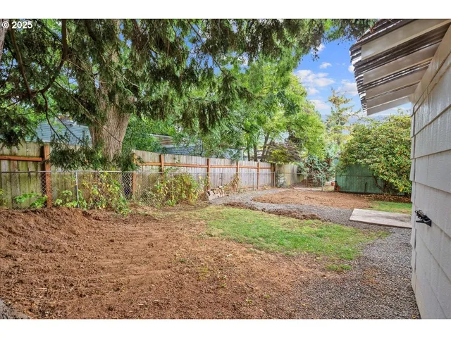 a backyard of a house with lots of green space