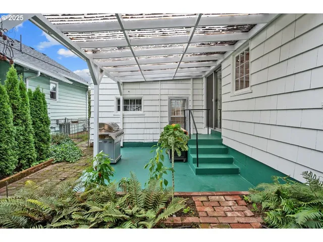 a view of a backyard with plants