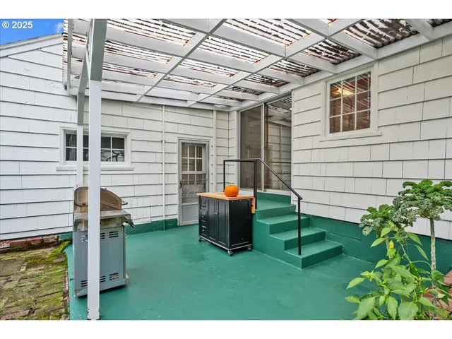 a view of a backyard with chairs