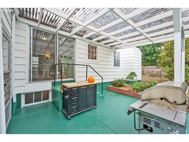 a view of backyard with deck and seating area