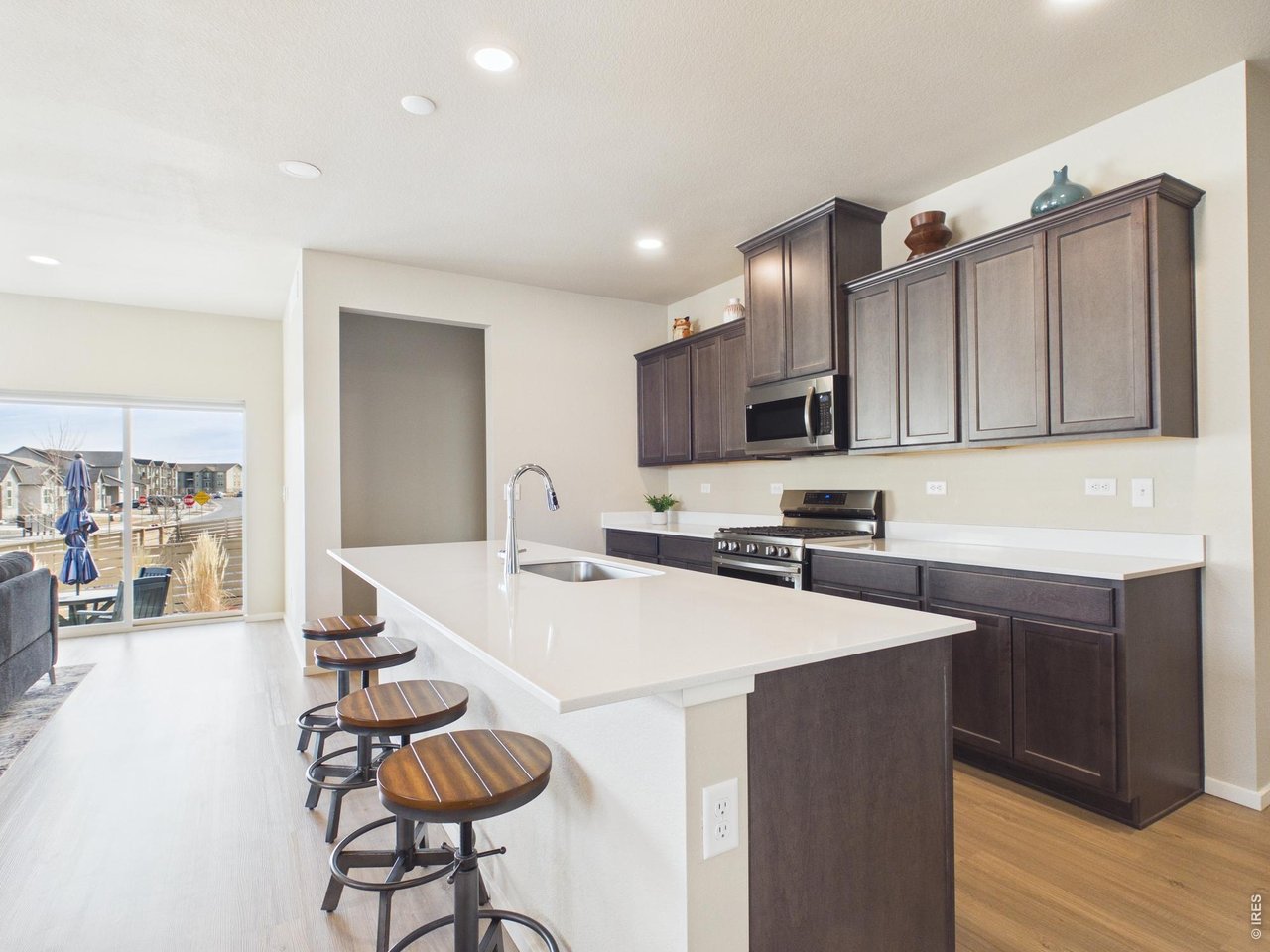 6602 6th Street Greeley, CO 80634 - Photo 7 of 38 Large kitchen island with quartz countertops throughout