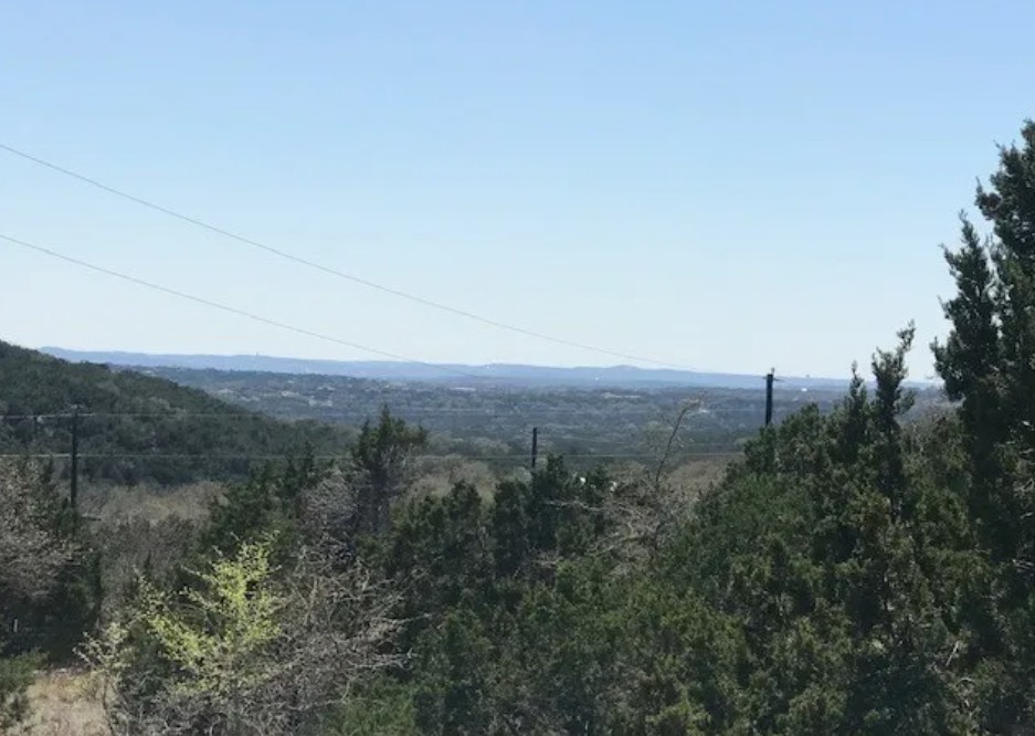 517 Left Fork Place Spring Branch, TX 78070 - Photo 2 of 12 a view of a city with lush green forest
