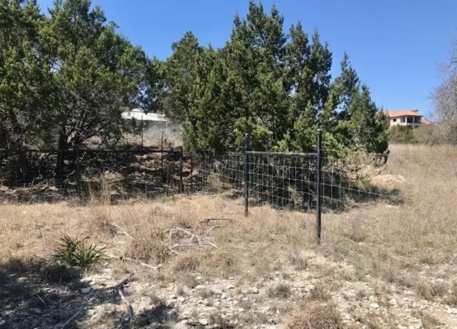 517 Left Fork Place Spring Branch, TX 78070 - Photo 5 of 12 a view of outdoor space with wooden fence