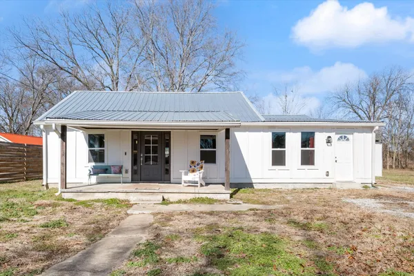 front view of a house with a yard