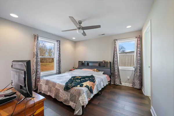 a bedroom with a bed and a window