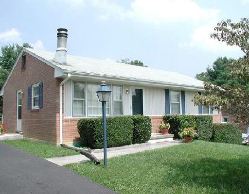 525 Holiday Road Vinton, VA 24179 - Photo 1 of 5 a front view of a house with garden