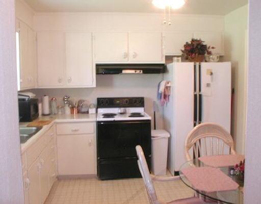 525 Holiday Road Vinton, VA 24179 - Photo 2 of 5 a kitchen with stainless steel appliances granite countertop a sink stove and refrigerator