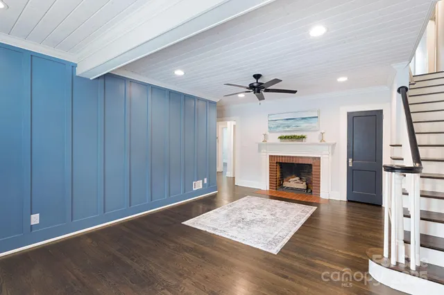 a view of an empty room with a fireplace