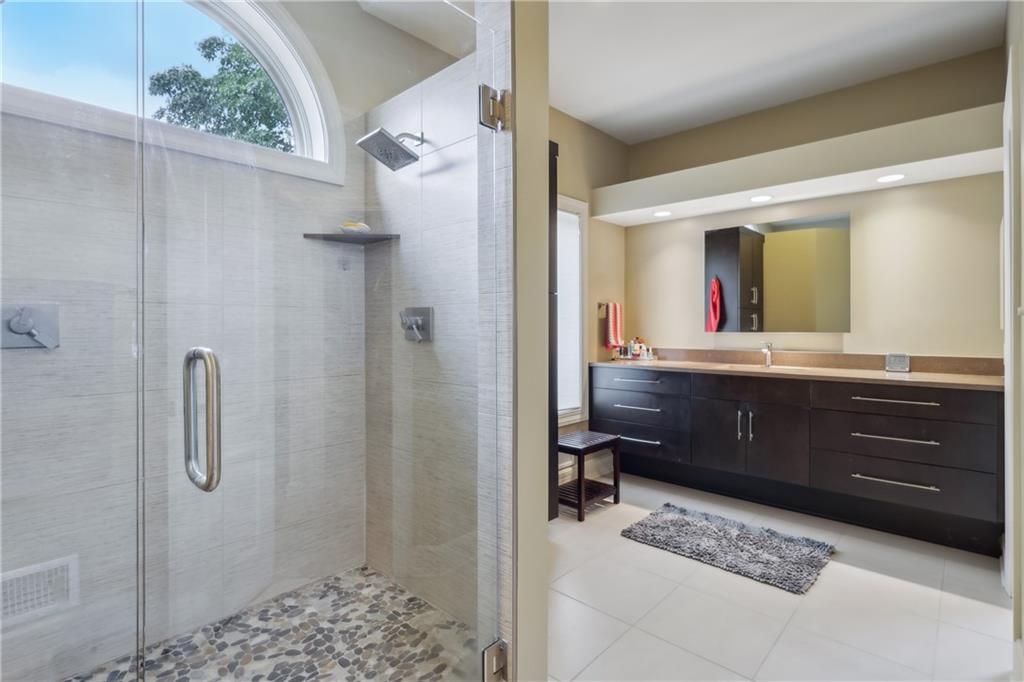 7091 Pinehurst Drive Presto, PA 15142 - Photo 11 of 29 a bathroom with a sink a mirror and a shower