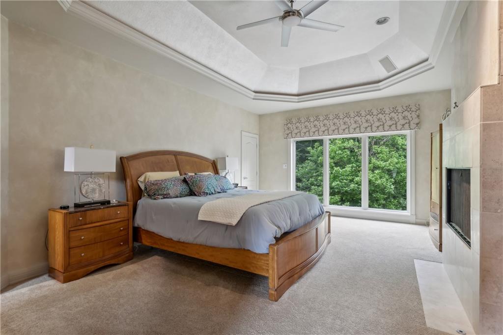 7091 Pinehurst Drive Presto, PA 15142 - Photo 12 of 29 a spacious bedroom with a bed lamp and a large window