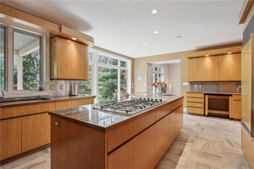 7091 Pinehurst Drive Presto, PA 15142 - Photo 5 of 29 a kitchen with stainless steel appliances granite countertop a sink stove and cabinets