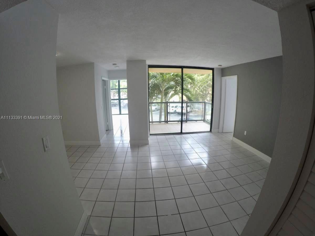 11780 Southwest 18th Street, Unit 2292 Miami, FL 33175 - Photo 4 of 10 a view of an empty room with glass door