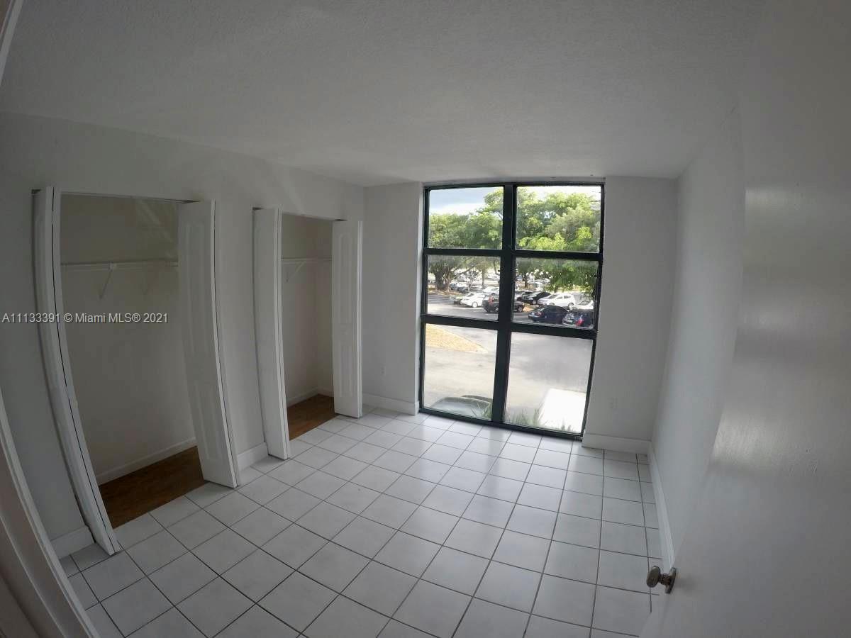 11780 Southwest 18th Street, Unit 2292 Miami, FL 33175 - Photo 7 of 10 a view of an empty room with a window