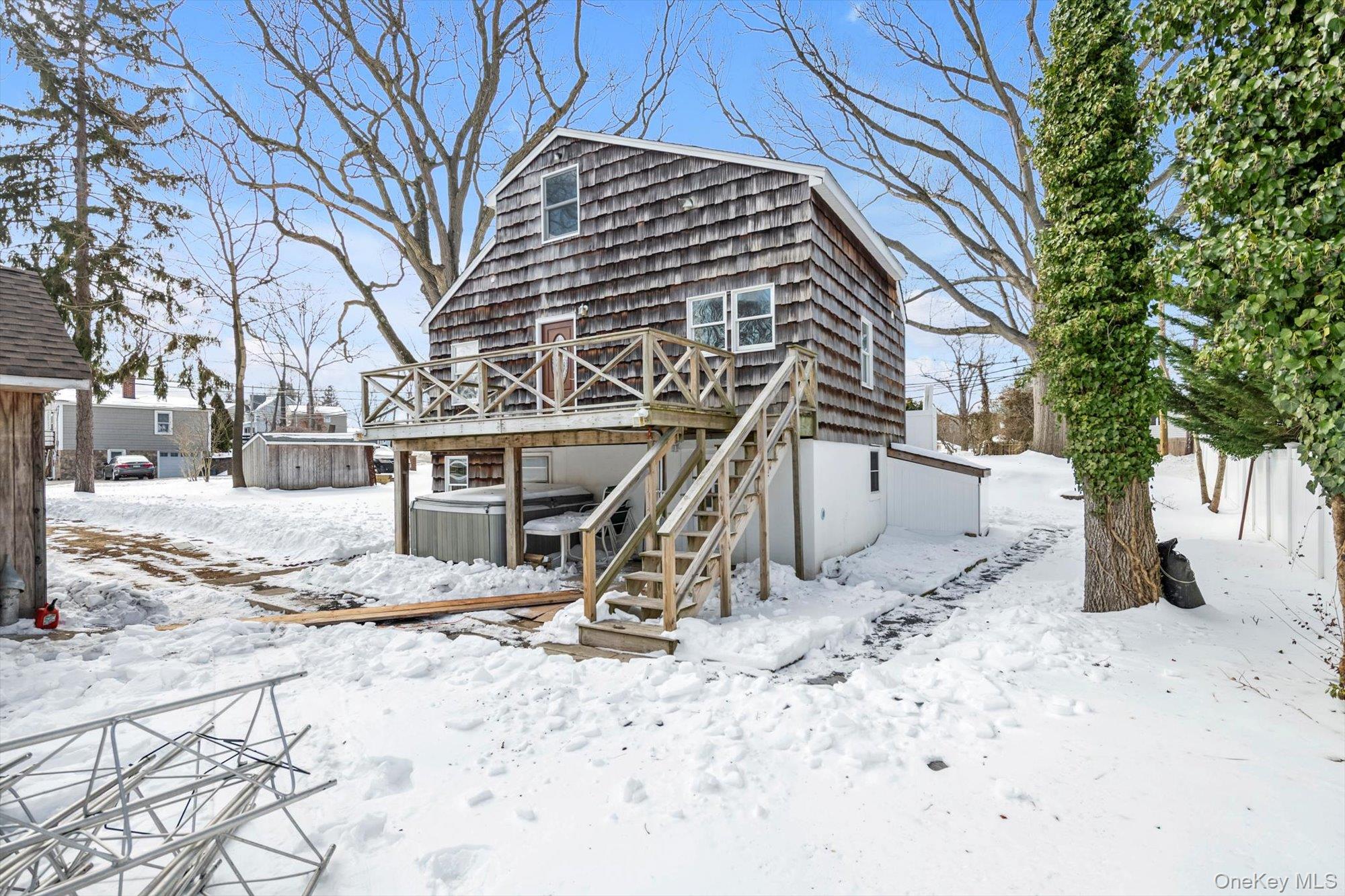 1117 St Johnland Road Kings Park, NY 11754 - Photo 16 of 20 Showing the rear deck and lovely corner lot