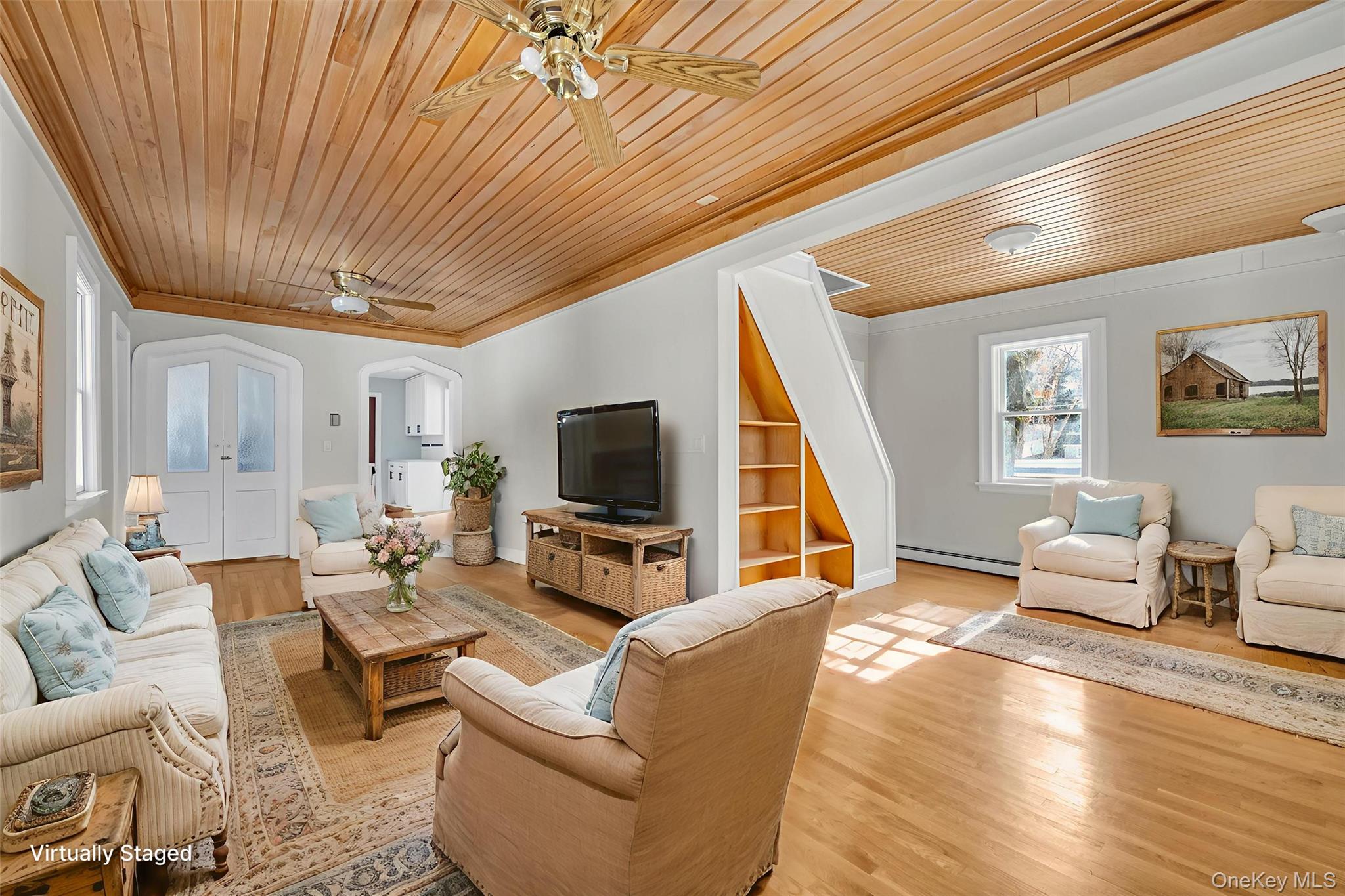 1117 St Johnland Road Kings Park, NY 11754 - Photo 2 of 20 Bright and spacious living room with built in shelving, gorgeous ceilings and gleaming hardwood flooring.