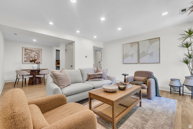 88 West 50 South, Unit C8 Centerville, UT 84014 - Photo 3 of 29 Open-concept living space featuring wood-finish flooring, recessed lighting, and a neutral color palette