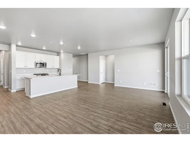 a view of kitchen with wooden floor