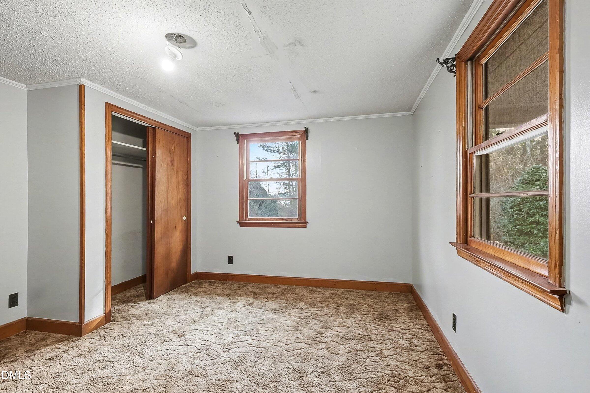 1249 Fann School Road Salemburg, NC 28385 - Photo 28 of 42 an empty room with windows