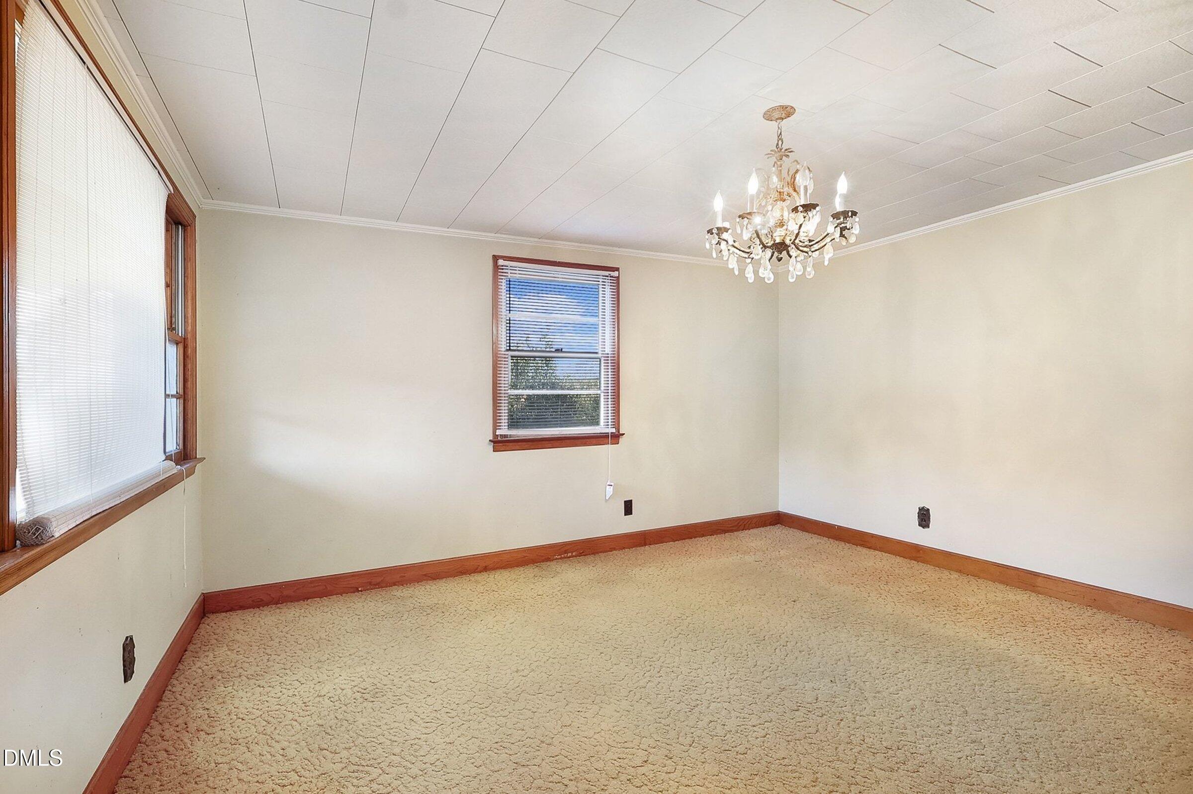 1249 Fann School Road Salemburg, NC 28385 - Photo 7 of 42 a view of an empty room with a window