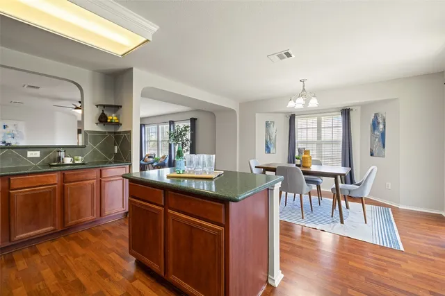 a kitchen with granite countertop counter top space and dining table