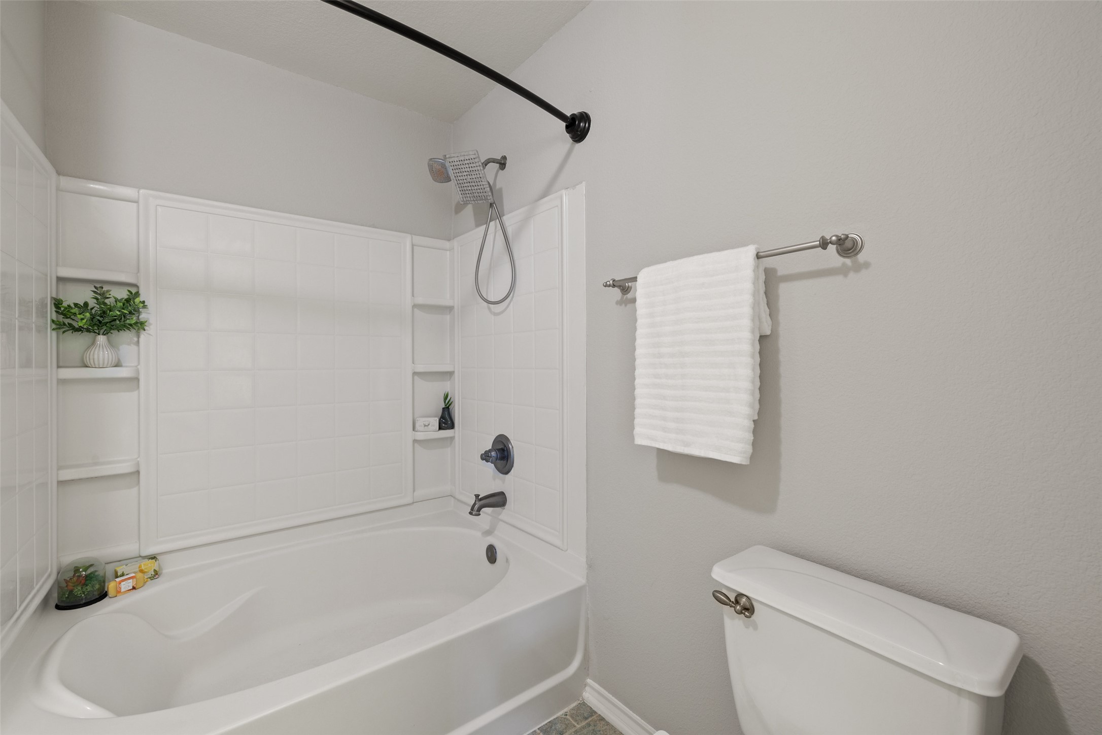 517 Castebar Drive Round Rock, TX 78664 - Photo 21 of 37 Bathroom featuring toilet and bathing tub / shower combination
