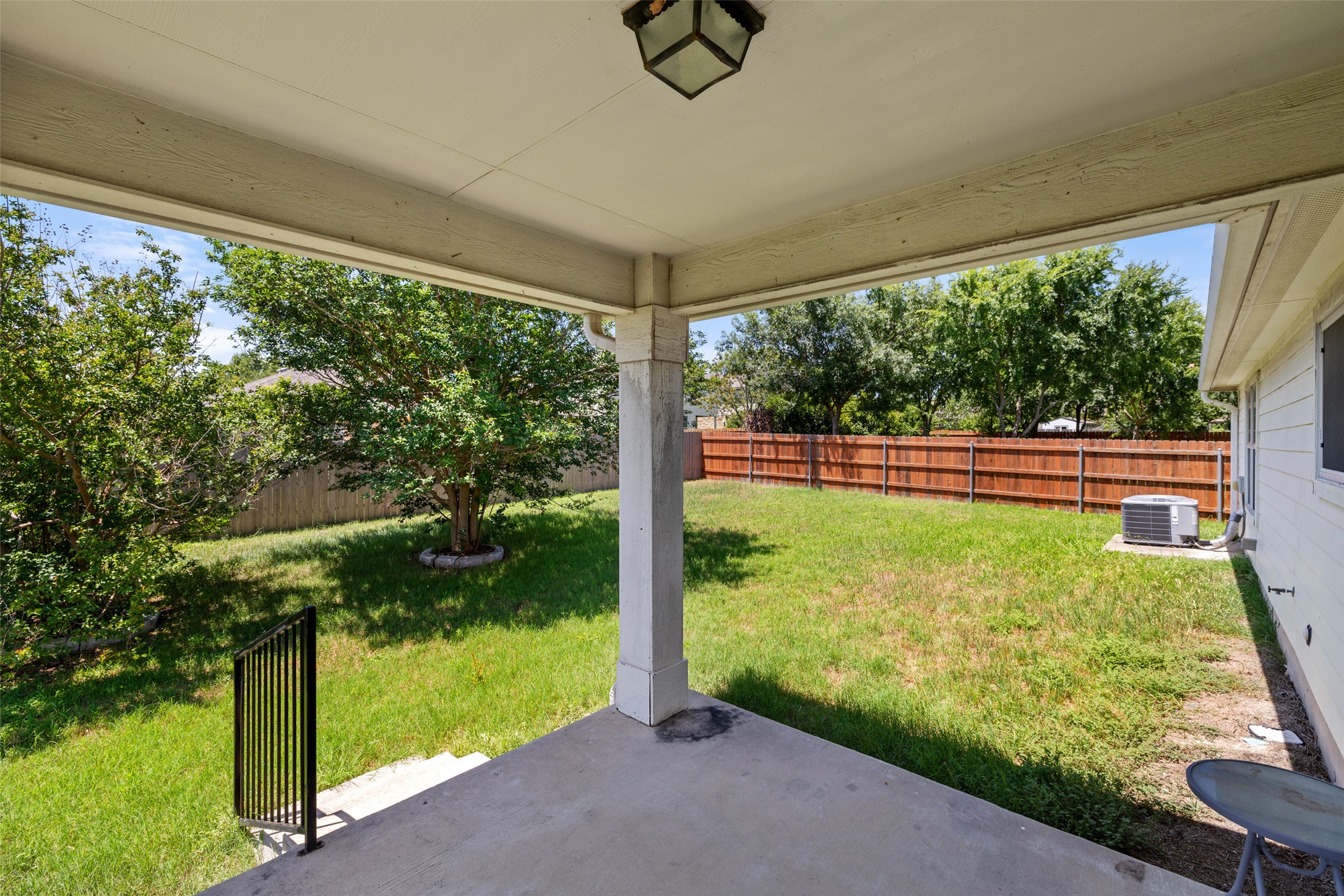 517 Castebar Drive Round Rock, TX 78664 - Photo 27 of 37 View of yard featuring a patio and central AC