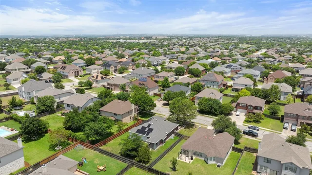 an aerial view of a city with lots of residential buildings