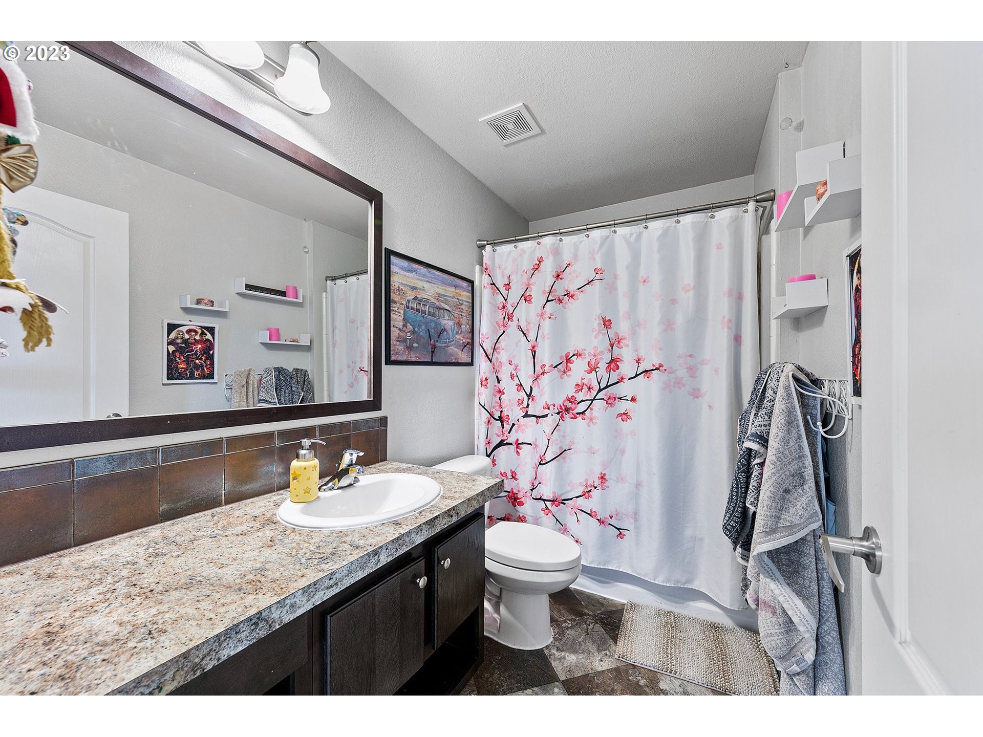 78124 Daybreak Drive Cottage Grove, OR 97424 - Photo 29 of 46 a bathroom with a granite countertop sink and a mirror