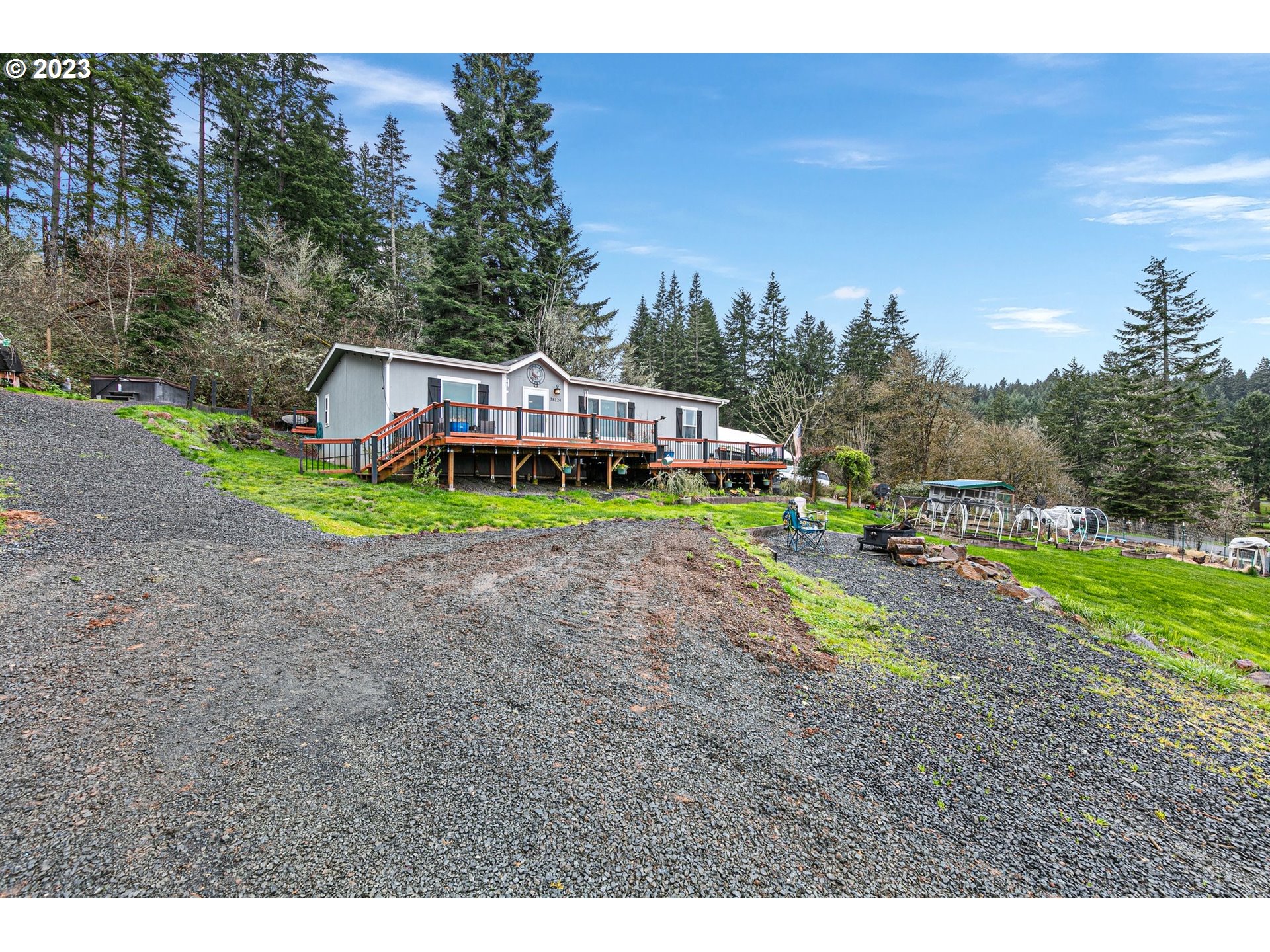 78124 Daybreak Drive Cottage Grove, OR 97424 - Photo 34 of 46 a view of a house with garden and a yard