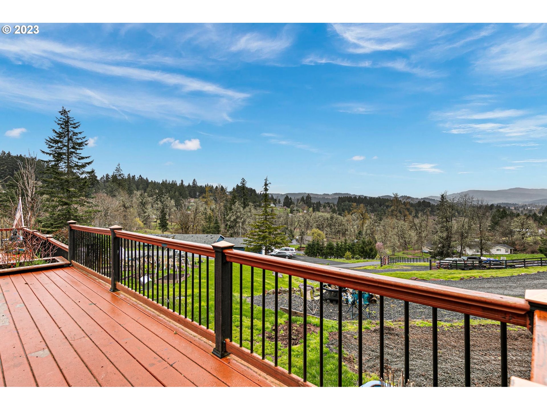 78124 Daybreak Drive Cottage Grove, OR 97424 - Photo 4 of 46 a view of city and mountain from a balcony