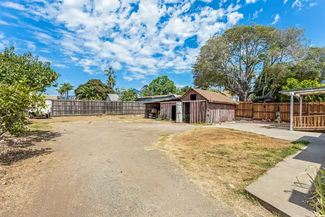 a house with trees in the background
