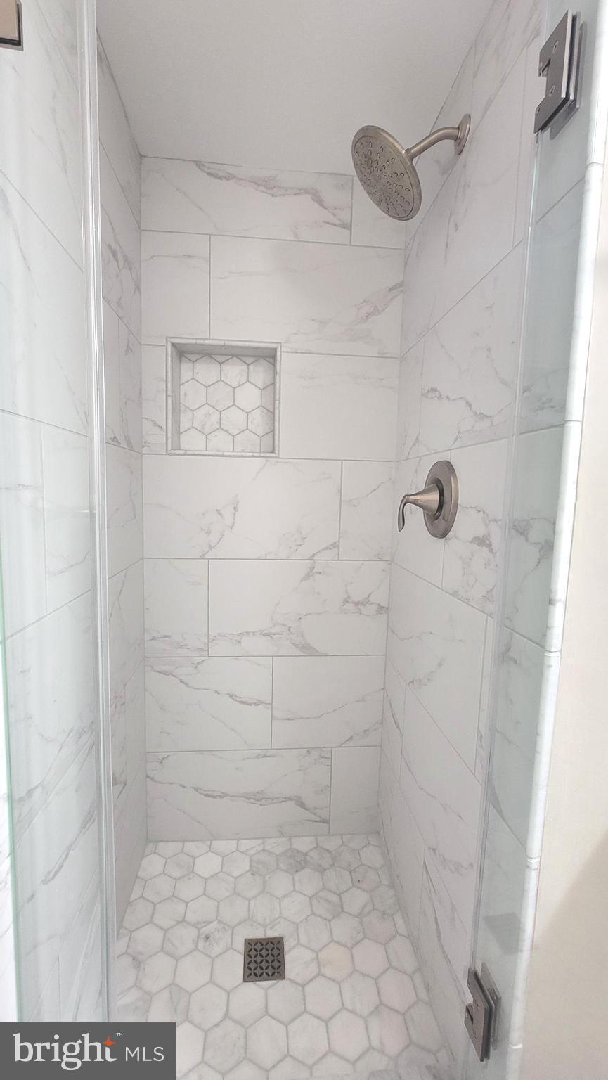 2111 Wisconsin Avenue Northwest, Unit 109 Washington, DC 20007 - Photo 33 of 50 a bathroom with a shower