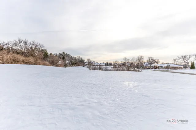 a view of a chair and tables in the patio