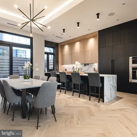 a dining room with furniture and window