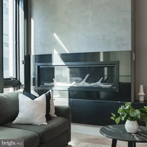 a living room with furniture and flowers