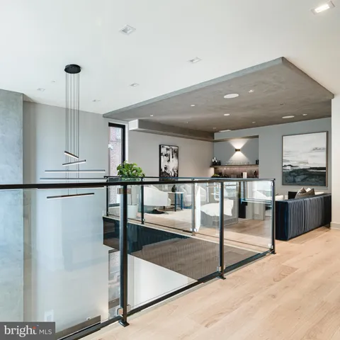 a kitchen with stainless steel appliances kitchen island granite countertop a refrigerator a stove and a sink