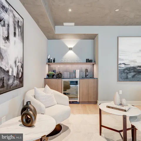 a bedroom with a large bed and a large window