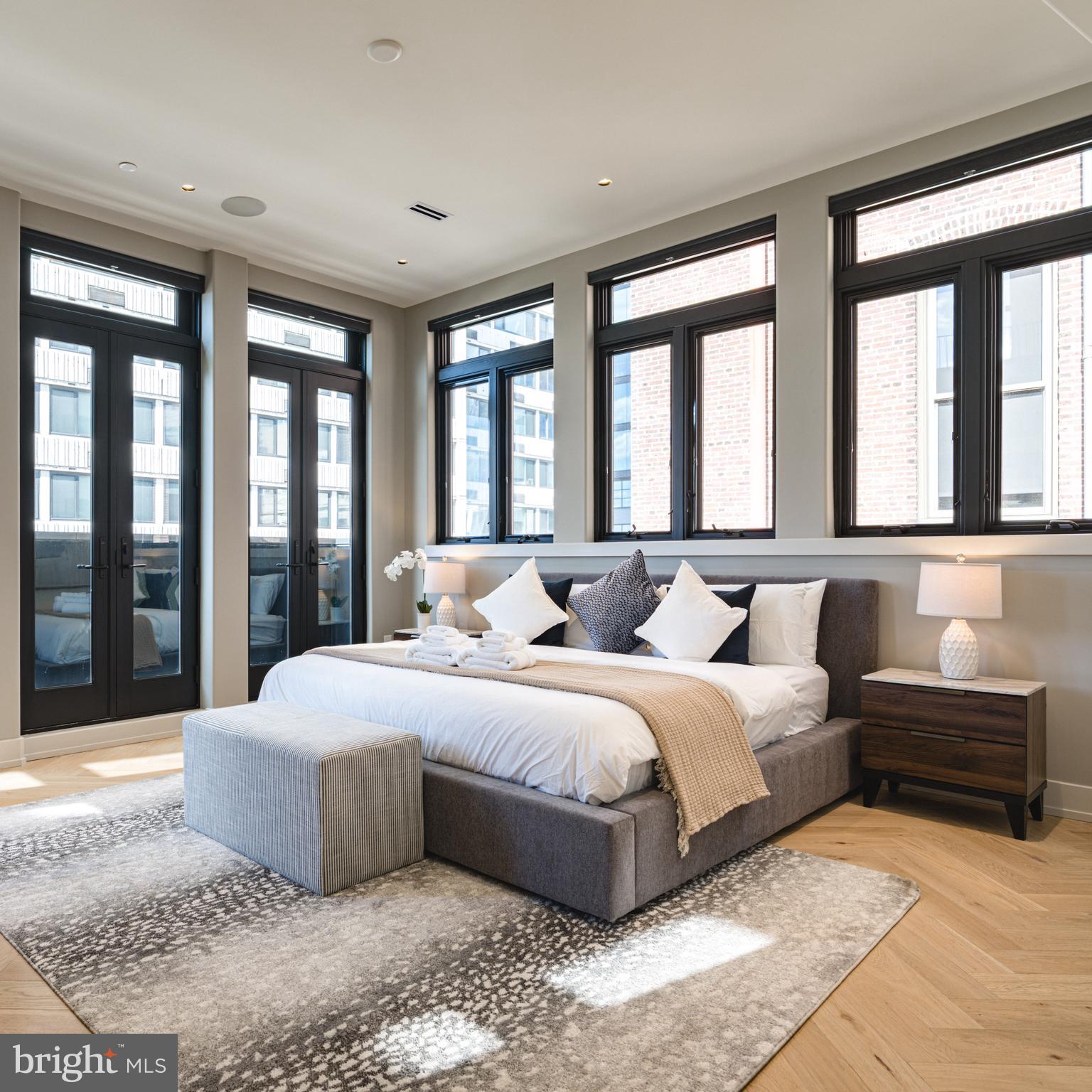 109 South 24th Street Philadelphia, PA 19103 - Photo 18 of 55 a bedroom with a large bed and a large window