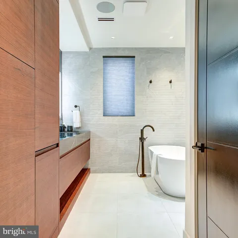 a bathroom with a bathtub and shower