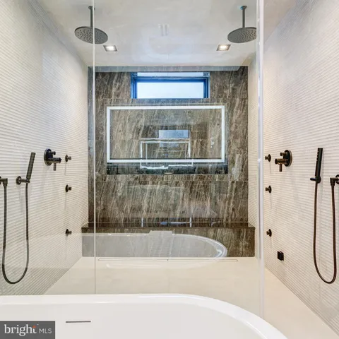 a bathroom with a toilet and a shower curtain