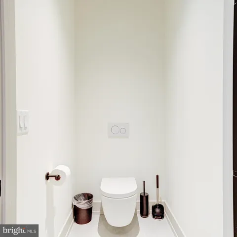 a room with walk in closet and empty racks